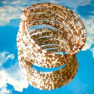 Layered tan and white bracelet layered